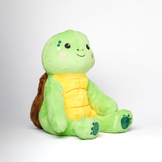 Peluche lestée tortue Hugsback verte, vue de profil sur fond blanc