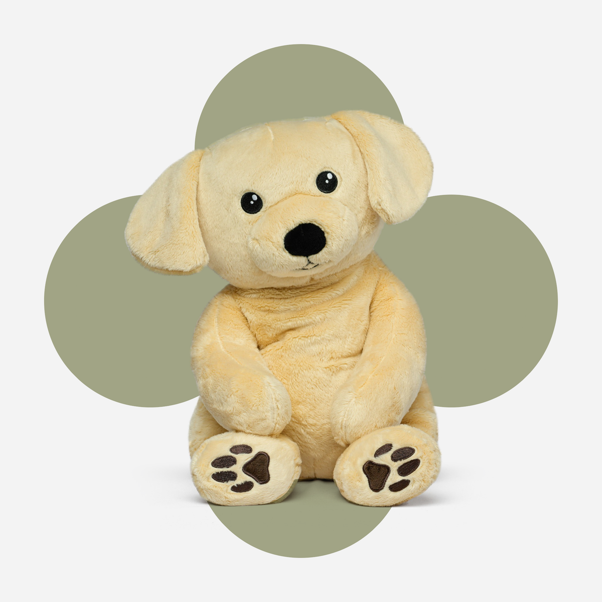 Hugsback weighted plush dog with a flower-shaped background