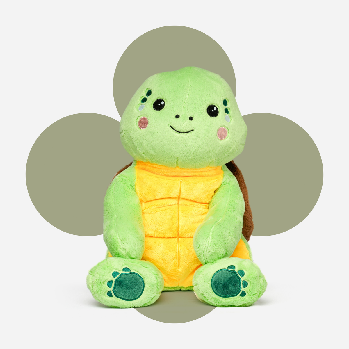 Hugsback weighted plush turtle with a flower-shaped background