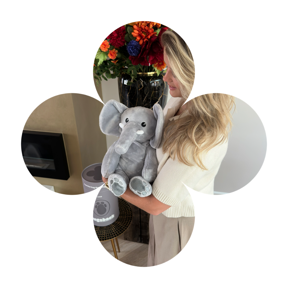 Femme avec la peluche lestée éléphant grise dans une forme de trèfle