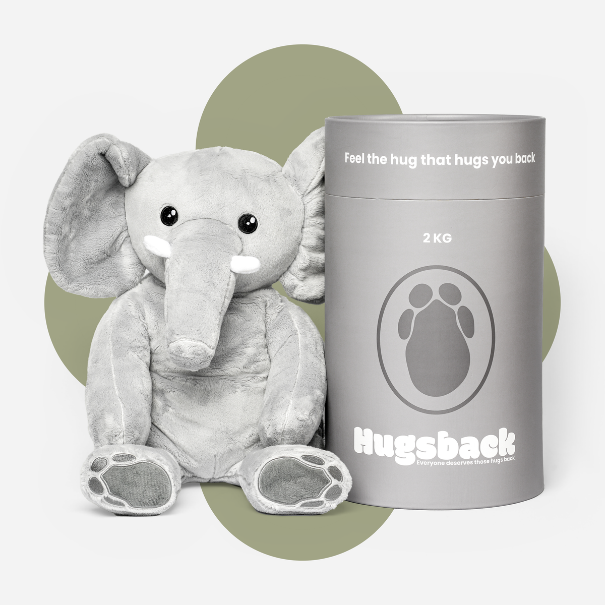 Hugsback verzwaringsknuffel olifant van 2 kg naast de grijze cadeaukoker