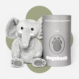 Hugsback verzwaringsknuffel olifant van 2 kg naast de grijze cadeaukoker