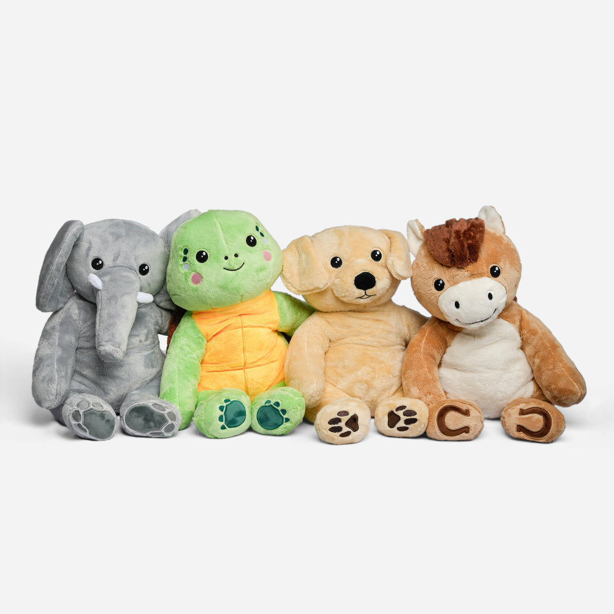 Komplet pakke med Hugsbacks tyngdebamser (elefant, skildpadde, hund og hest) på lysegrå baggrund