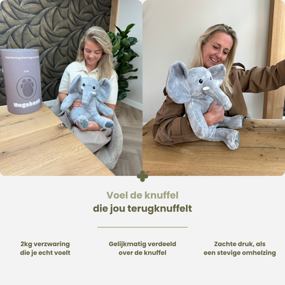 Kvinde krammer tyngdebamsen elefant på 2 kg ved bordet